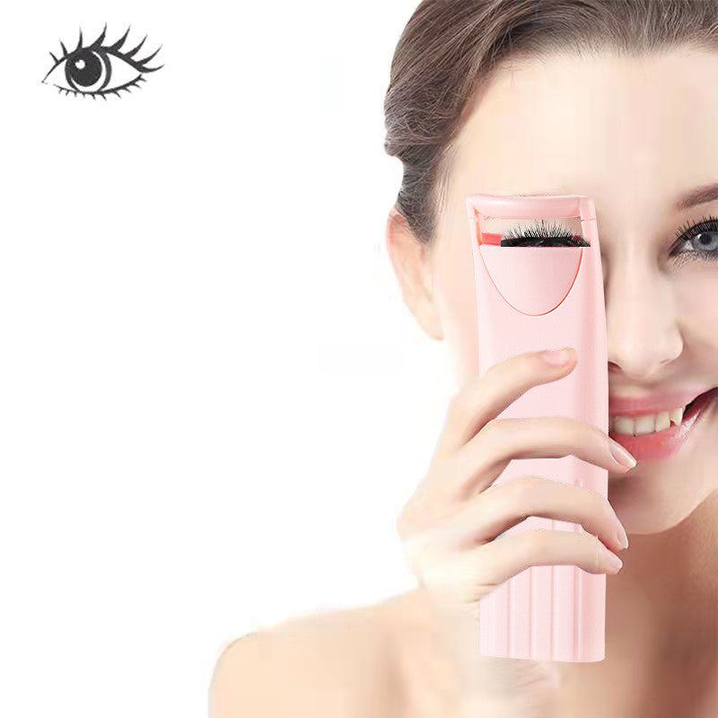 Heated eyelash curler in use